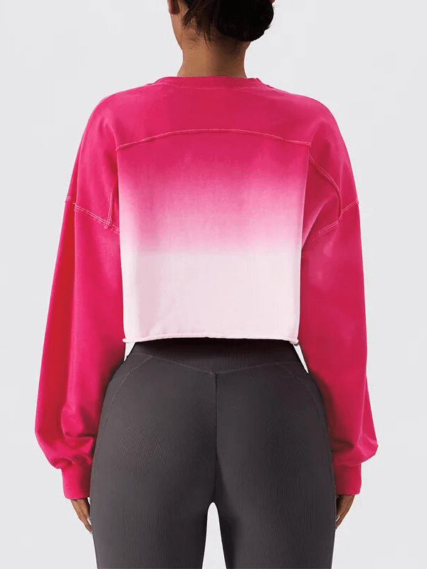 Back view of a woman wearing a pink gradient long sleeve O-neck crop top, highlighted for breathable cotton and stylish design - SF1700.
